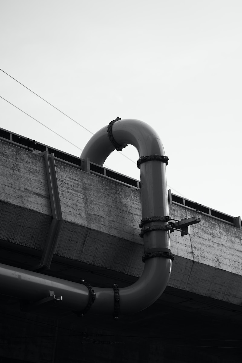 grayscale photography of black pipe